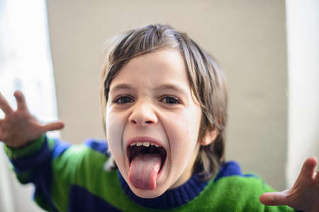 child makes grimacesの写真素材