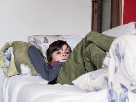 child lying on the sofaの写真素材