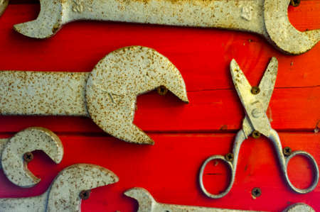 old and used english keys on red backgroundの写真素材