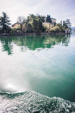 view of the island of San Giulio on Lake Orta, one of the most romantic lakes in Europeの写真素材