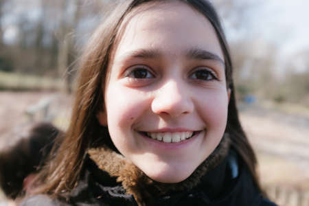 portrait of ten year old girl in outdoor smilingの写真素材