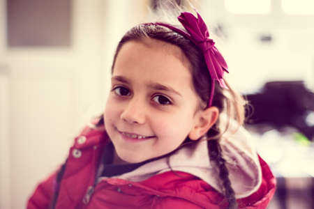 portrait of smiling little girl in her homeの写真素材
