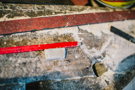 carpenter workbench with tools and sawdust viewed from above