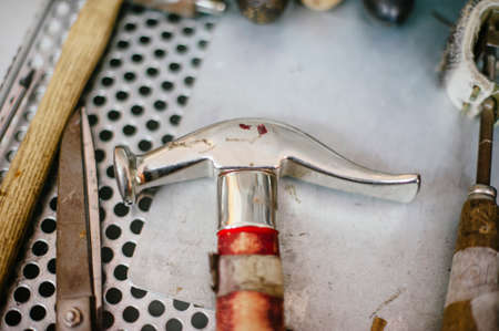 interior repair shop and shoe making, tools to repair shoes hammer pliersの写真素材