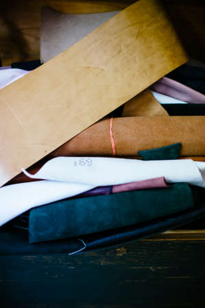 interior repair shop and shoe making, close-up view leather piecesの写真素材