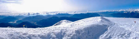 panoramic photo of mountain landscape mount Lema, snowy peak with signs of ski
