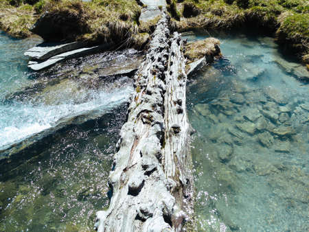 River stream flowing among meadowsの写真素材