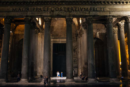 Rome-September 16, 2017-Pantheon by night, tourists converse quietly under the lights between the columnsのeditorial素材