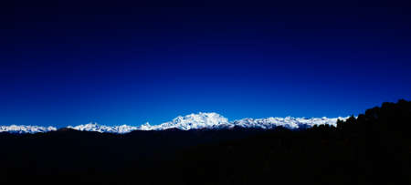 panorama of the alpine chain with Monte Rosa illuminated by the sun in the morningの写真素材