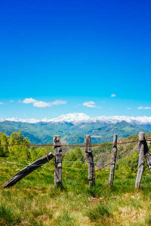 Rural fence in the mountains on the Alps, Mottarone, Stresa, Italyの写真素材