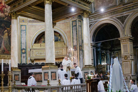 Rome-Italy-10-24-2015. Holy Pontifical Mass in an ancient rite at the Saint Peter's Chair, Mass in Latin, in the Basilica of Saint Peter's in the Vatican, pilgrimage summorum pontificumのeditorial素材