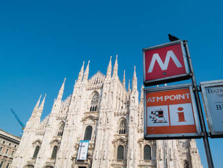 MILAN-ITALY-03 12 2014, Piazza del Duomo, gothic cathedral, subway stop sign with letter Mのeditorial素材