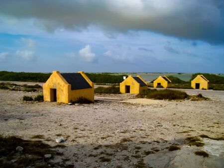 Slave huts built on the southwest coast of Bonaire in the 1850s near Bonaire's Salt Lake. Most slaves worked the salt flats, while others were forced to cultivate maize or cut dyewood.の写真素材