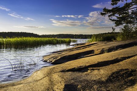 Beautiful rocky coastline at twilight on the Archipelago of Finland during summer.の写真素材