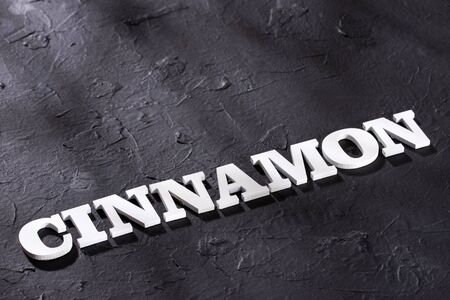 Cinnamon word in letters - brown cinnamon. Cinnamomum verumの写真素材