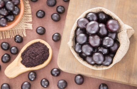 Acai powder and berries - Euterpe oleraceaの写真素材