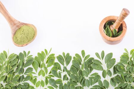 Fresh leaves and moringa powder - Moringa oleifera. Top viewの写真素材