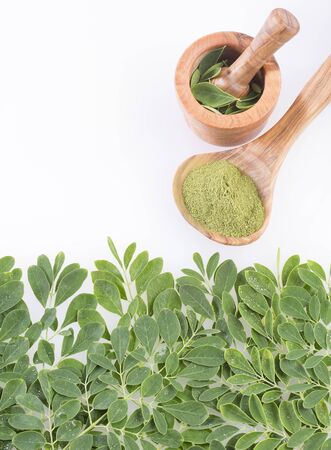 Fresh leaves and moringa powder - Moringa oleifera. Top viewの写真素材