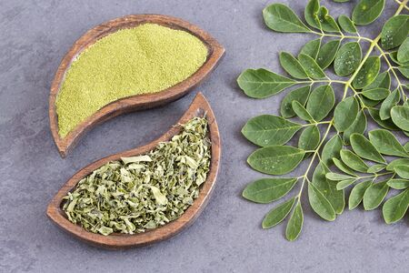Fresh leaves and moringa powder - Moringa oleifera. Top viewの写真素材
