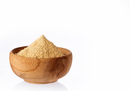 Bowl of maca powder on white backgroundの写真素材