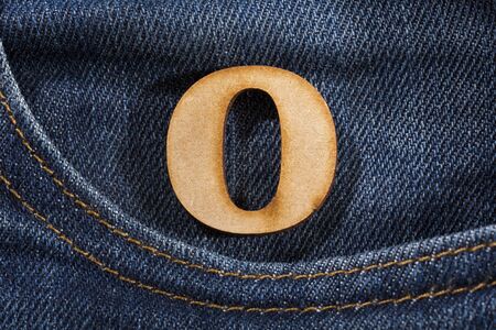 Letter O of the alphabet - blue jeans texture background