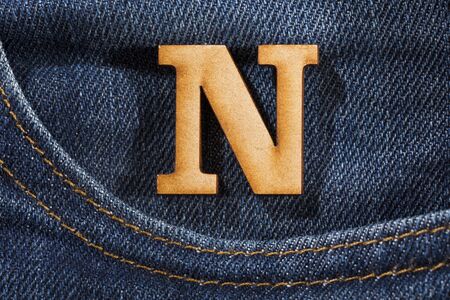 Letter N of the alphabet - blue jeans texture backgroundの写真素材