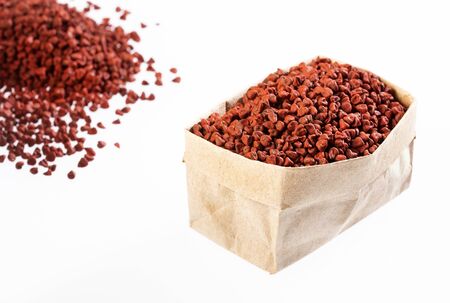 Bixa Orellana - Organic achiote seeds in paper bagの写真素材