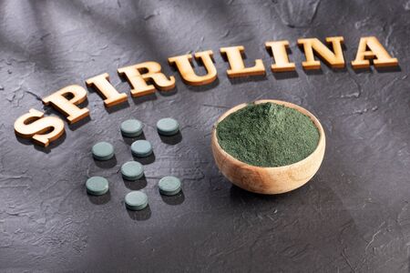 spirulina powder and spirulina pills - healthy superfood diet and detox nutrition conceptの写真素材