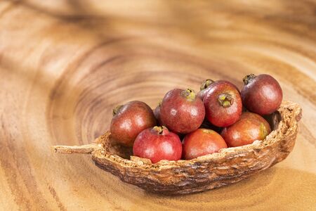 Psidium cattleianum - Strawberry guavas. Text space