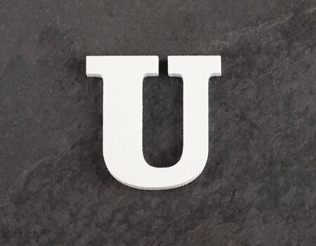 Letter U from blank alphabet on gray backgroundの写真素材