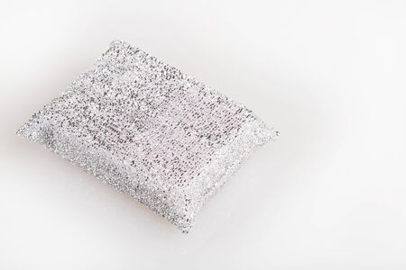 Sponge on white background. Silver sponge for cleaning the homeの写真素材