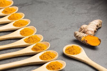 Fresh organic root and turmeric powder - Curcuma longa