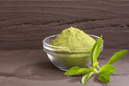 Natural sweetener in powder from stevia plant - Stevia rebaudianaの写真素材