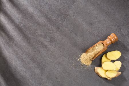 Fresh ginger root and ground ginger spice