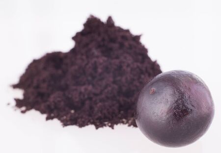 Acai powder and berries - Euterpe oleraceaの写真素材