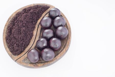 Acai powder and berries - Euterpe oleraceaの写真素材