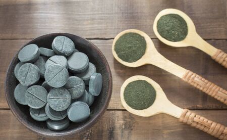 Spirulina algae powder and tablets. Arthrospira platensisの写真素材