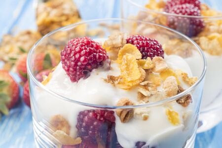 Muesli bowl with granola, strawberries and yogurt.
