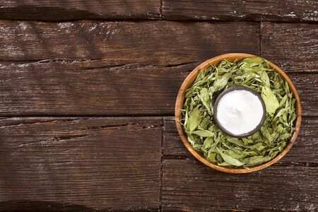 Natural sweetener in powder from stevia plant - Stevia rebaudiana. Sweetener