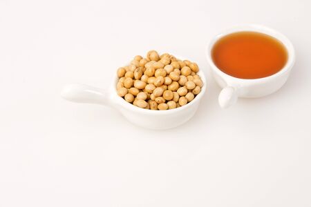 Oil and soybeans - Glycine max. White backgroundの写真素材