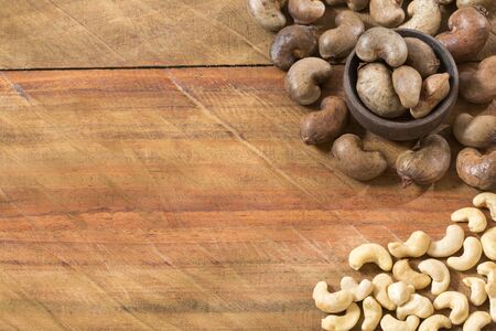 Cashew nut on wooden background - Anacardium occidentaleの写真素材