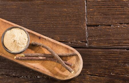 Licorice powder and roots - Glycyrrhiza glabraの写真素材