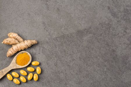 Roots, powder and turmeric pills - Curcuma longa.の写真素材