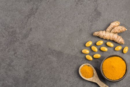 Roots, powder and turmeric pills - Curcuma longa.の写真素材