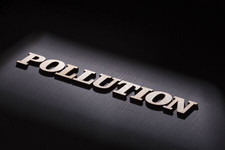 Word pollution in wooden letters. Top viewの写真素材