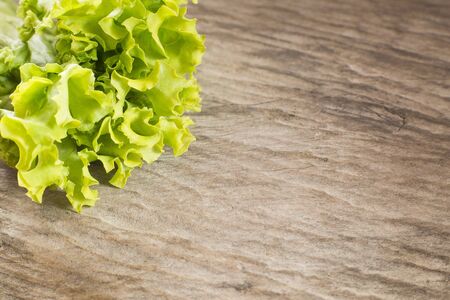 Kale powder on wooden background - Brassica oleracea var. Sabellica L.の写真素材