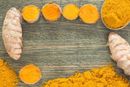 Turmeric powder and fresh turmeric. Curcuma longaの写真素材