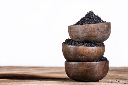 Hawaiian black salt in wooden bowls - text spaceの写真素材