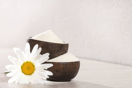 Hydrolyzed collagen protein in wooden bowls with space for textの写真素材