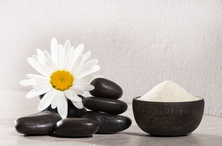 Hydrolyzed collagen protein in wooden bowl and flowerの写真素材